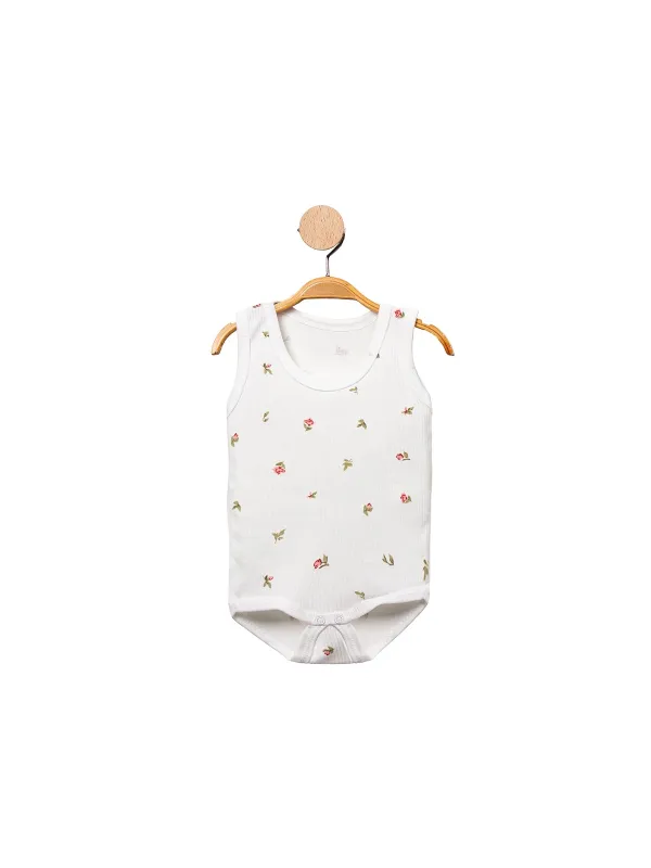 White baby girl bodysuit with delicate cotton flowers
